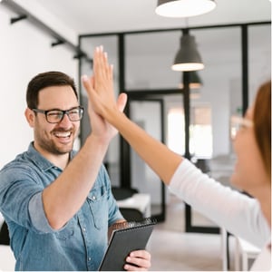Man high five woman